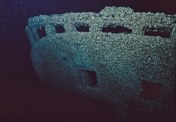In this 2010 photo taken from video and provided by Michigan Shipwreck Research Associates, the stern of an unnamed 60-foot, single-masted sloop, covered in zebra mussels, that may date back to the 1830s, is shown in Lake Michigan. The wreck was found off southwestern Michigan in water about 250 feet deep between Saugatuck and South Haven, Mich. 